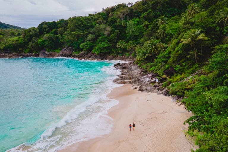 Hidden Gems in Phuket: A serene hidden gem beach in Phuket surrounded by lush greenery, perfect for private charters and crowd-free island adventures.