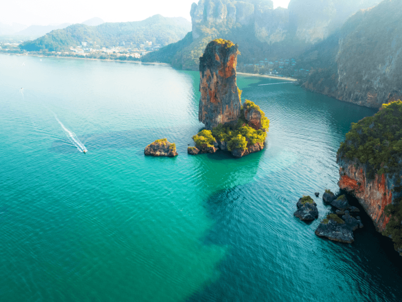 A stunning aerial view of Phi Phi Islands featuring towering limestone rock formations surrounded by turquoise waters.