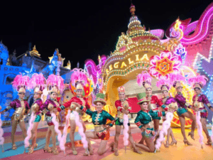 carnival night shows in Phuket: Performers in vibrant costumes at Carnival Magic in Phuket during a spectacular night show with colourful lights and elaborate decorations.