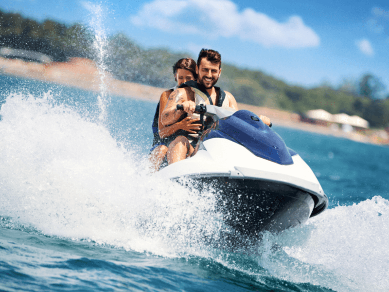 Couple Enjoying Jet Ski Adventure in Phuket with Scenic Views