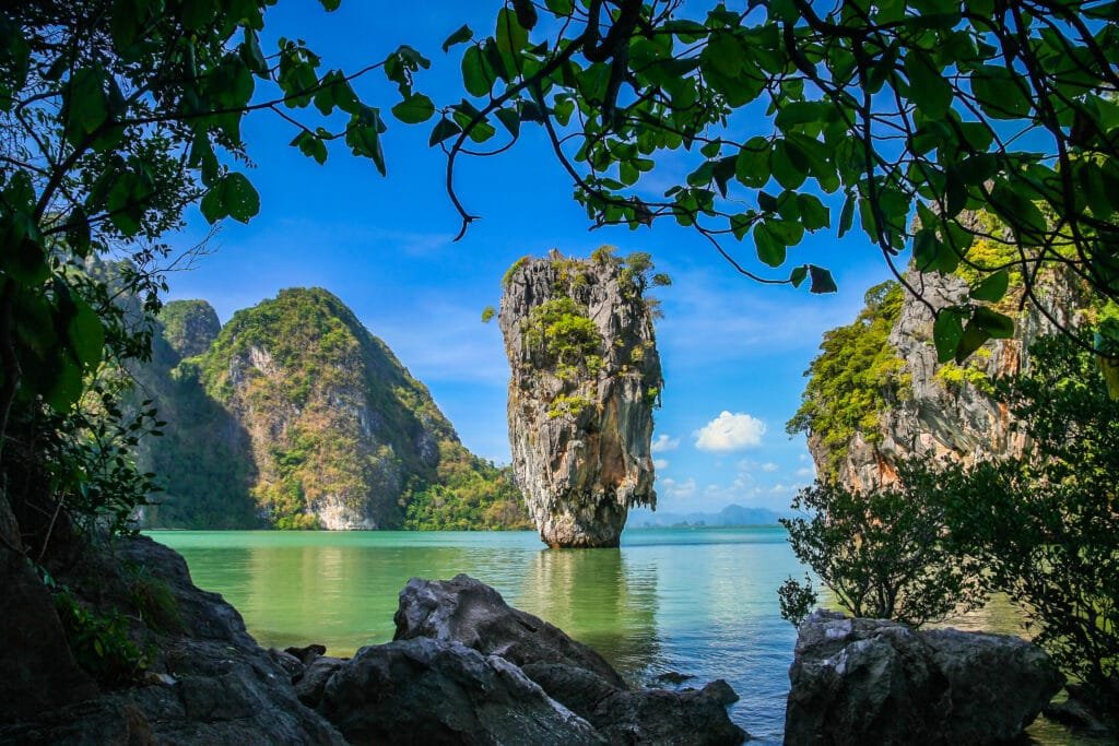  luxury island escapes from Phuket: James Bond Island with towering limestone cliffs and emerald waters in Phang Nga Bay, perfect for private speedboat charters from Phuket.