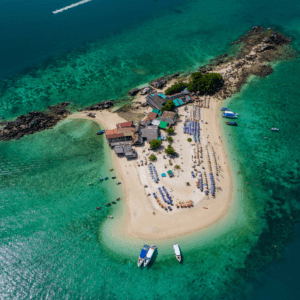 Khai island tour: A stunning aerial view of Khai Island, surrounded by turquoise waters, speedboats, and sandy beaches, showcasing the vibrant island paradise.