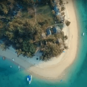 Naka Noi Island Private Charter: Aerial view of Naka Noi Island showcasing its pristine sandy beach, turquoise waters, and tropical palm trees.