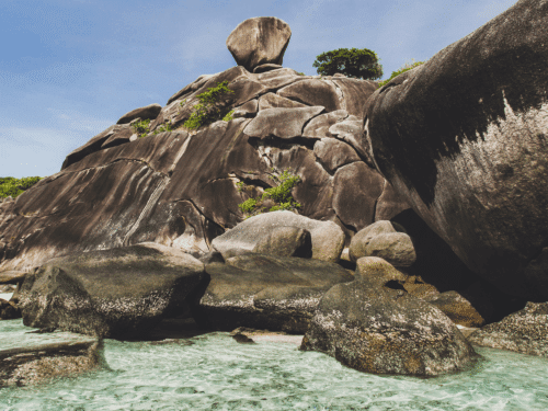 Unique rock formations in Similan Islands surrounded by crystal-clear waters.