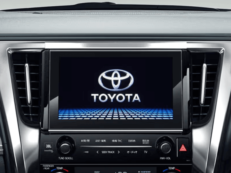 Toyota Alphard luxury infotainment system with Toyota logo on the digital screen.